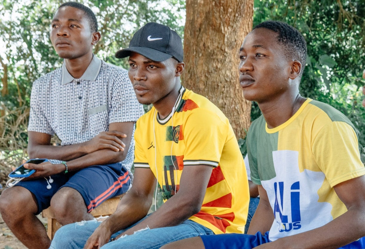 Luc (centre) and Raymond (right) are members of the Committed Boys Club and say it has opened their eyes. 